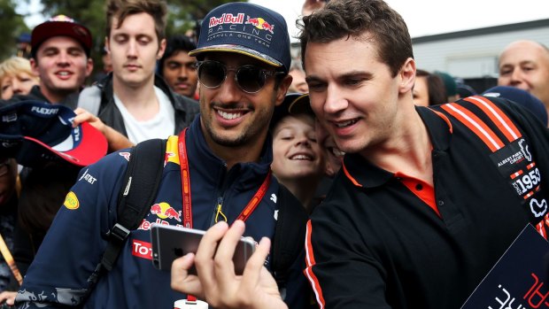 Selfie spot: Daniel Ricciardo poses for a photo with a fan on the Melbourne Walk during last year's Australian Grand Prix.