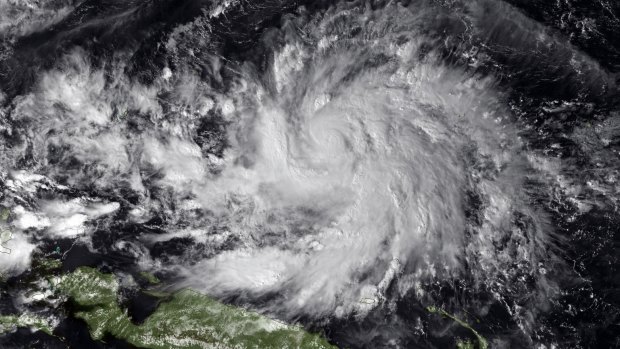 Typhoon Hagupit is seen to the north of New Guinea in this image from Tuesday.