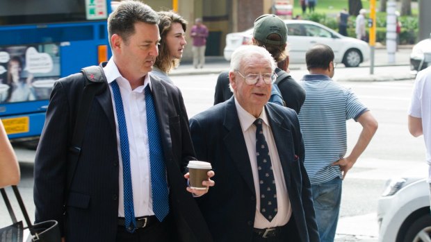 Rodger Leighton, who allegedly groped girls after giving them nitrous oxide, outside court with his barrister, Andrew Miller (left).  