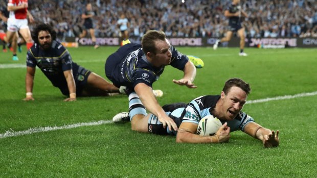 King James: James Maloney crosses as the Sharks sealed their place in the grand final with victory over North Queensland.