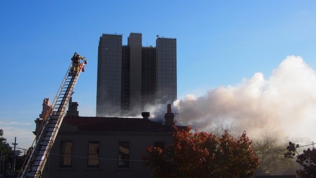 Firefighters in the roof, where the blaze spread.