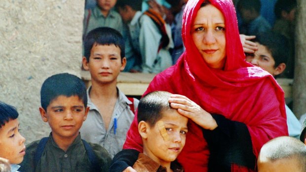 Mahboba Rawi with orphaned Afghan children in Pakistan. 