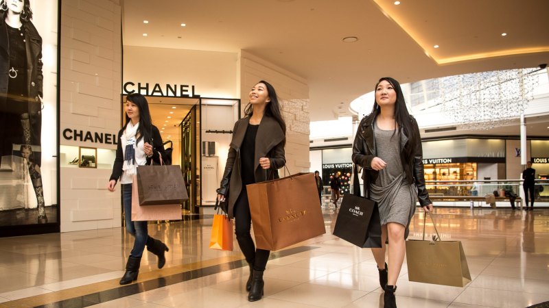 Asian Tourist Girl With A Louis Vuitton Shopping Bag On