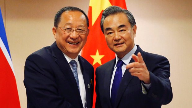 North Korean Foreign Minister Ri Yong Ho and his Chinese counterpart Wang Yi before their bilateral meeting at the ASEAN foreign ministers' meeting in Manila.