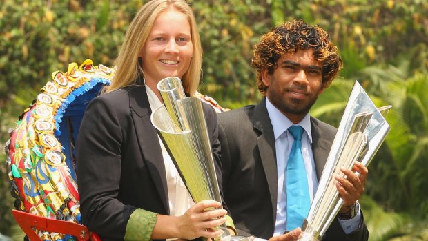 Australia's Meg Lanning and Sri Lanka's Lasith Malinga with the World T20 trophies after the 2014 finals.