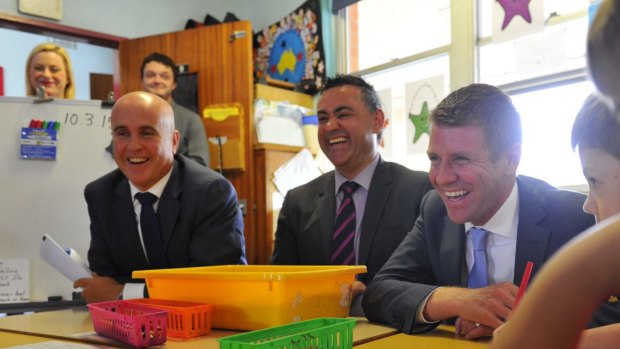 Education Minister Adrian Piccoli, Skills Minister John Barilaro (centre), and NSW Premier Mike Baird. The free TAFE scholarships have boosted course enrolments.