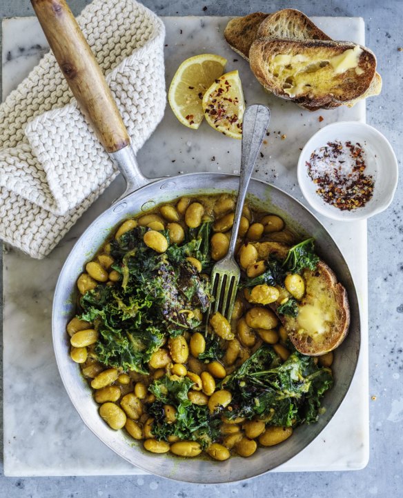 Budget-friendly beans on toast, pictured with pan-fried kale (optional).