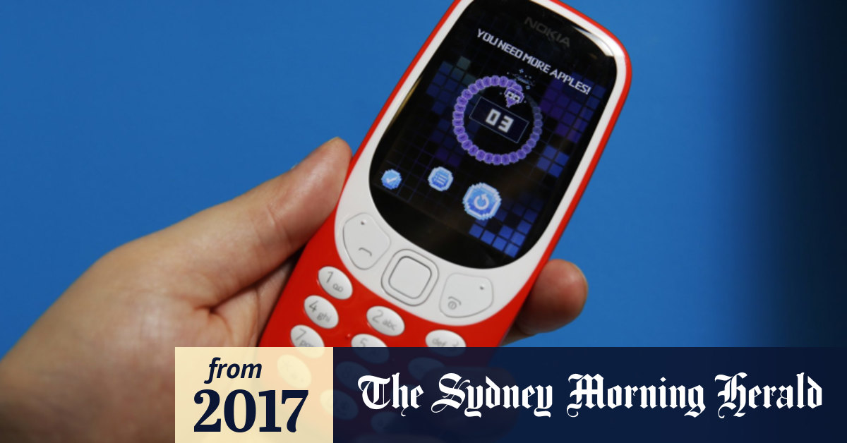 A person plays the classic mobile game Snake as the new Nokia 3310