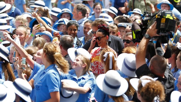 Phone fetish: Katy Perry was welcomed by smart phones instead of smiles at Loreto Mandeville Hall in Melbourne. 