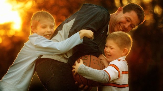 Brett Ratten plays with sons Cooper (left) and Tanner in 2007.