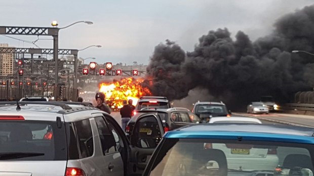 The bus fire brought traffic to a standstill on the bridge.