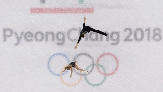 Australians Ekaterina Alexandrovskaya and Harley Windsor performing on the Olympic rings.