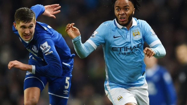 New teammates: John Stones (in action for Everton in January) and Raheem Sterling.