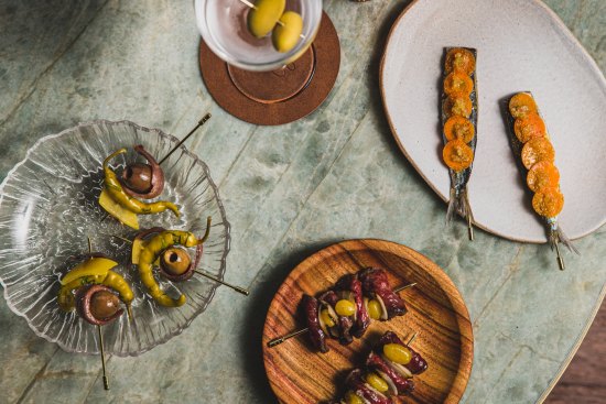 Gilda skewers (left) and Basque-inspired snacks at Gildas wine bar.