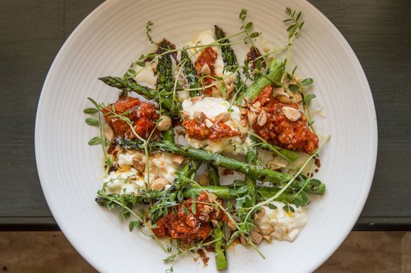 Stracciatella and grilled asparagus with romesco sauce at Union Dining.