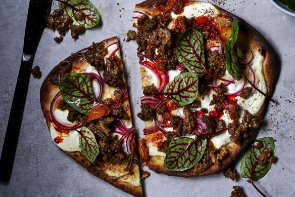 Spicy lamb naan pizza and Indian pickle.  