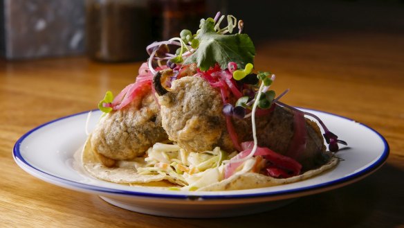 The fish tacos feature beer-battered swordfish-stuffed jalapenos.