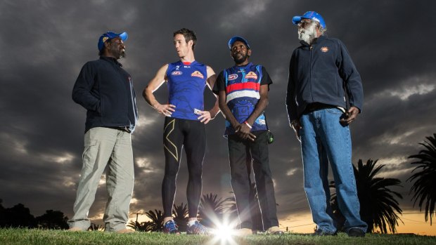 Bulldogs captain Robert Murphy, second left, with Martu rangers, from left,  Stewart Watson, McLean Williams and Ray Thomas. 