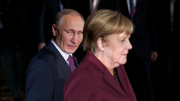 Russian President Vladimir Putin and German Chancellor Angela Merkel in Berlin.