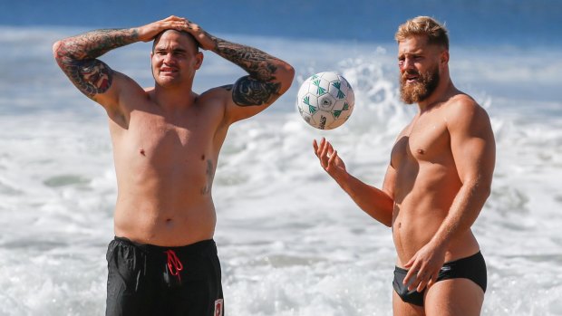 Ball skills: Jack de Belin (right) and Russell Packer at North Wollongong beach at a recovery session on Wednesday.