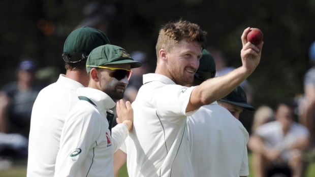 Match turner: Australia's Jackson Bird holds up the ball after his first five-wicket bag in Test cricket.