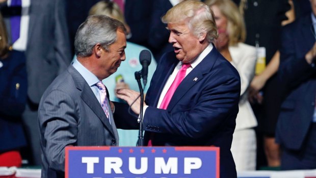 A meeting of like minds: Donald Trump welcomes Nigel Farage to the stage.