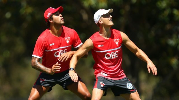 Left out: Ted Richards (right) trains with Lance Franklin.