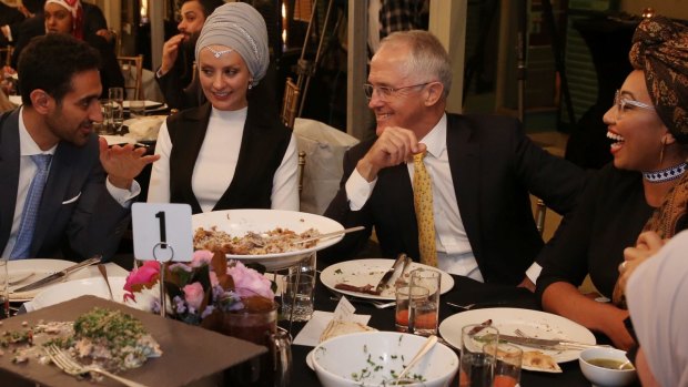 Waleed Aly (left) with his wife, Susan Carland (second left) attend Prime Minister Malcolm Turnbull's 2016 Iftar dinner.