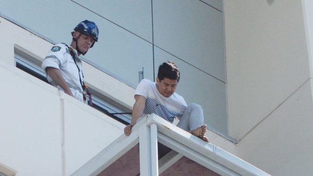 June Oh Seo on top of a balcony in Chatswood, above the alley where his girlfriend's body was found.