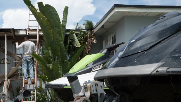 Contractors prepare a home ahead of Hurricane Irma in Miami, Florida, US. 
