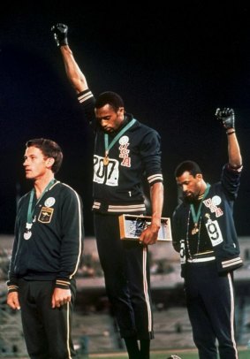 Powerful moment: Australia's Peter Norman (left) joins American athletes Tommie Smith and John Carlos on the podium during the famous "Black Power" demonstration.