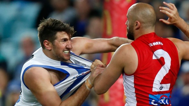 "A good player, and a good person": Jarrad Waite tangles with Rhyce Shaw of the Swans in last weekend's semi-final.