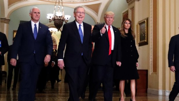 New era: Vice-President-elect Mike Pence, Senate Majority Leader Mitch McConnell, President-elect Donald Trump and his wife Melania at Capitol Hill on Friday.