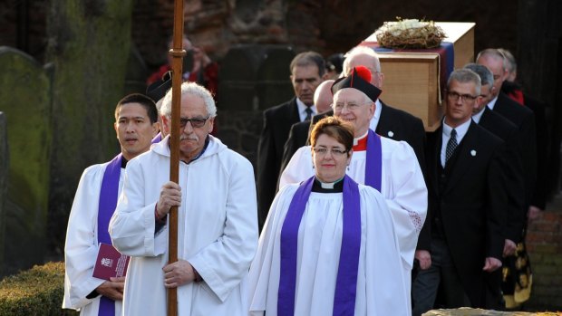 The coffin of Richard III emerges from the St Nicholas church in Leicester on Sunday.