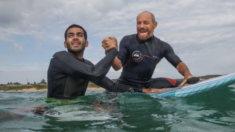 Blind surfer Derek Rabelo learns from Australian legend Tom Carroll