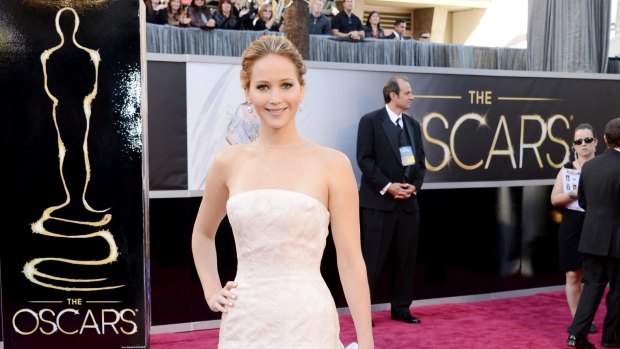 Jennifer Lawrence in clotted cream Dior at the 2013 Oscars...before she fell up the stairs.