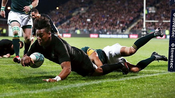 Too easy: Julian Savea goes over to score in the corner.