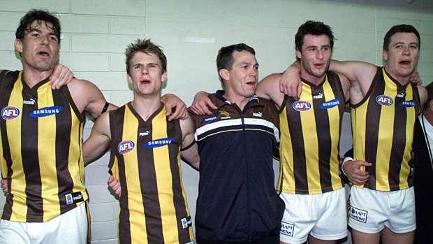 Hawthorn coach Peter Schwab celebrates with the Hawks after their win.