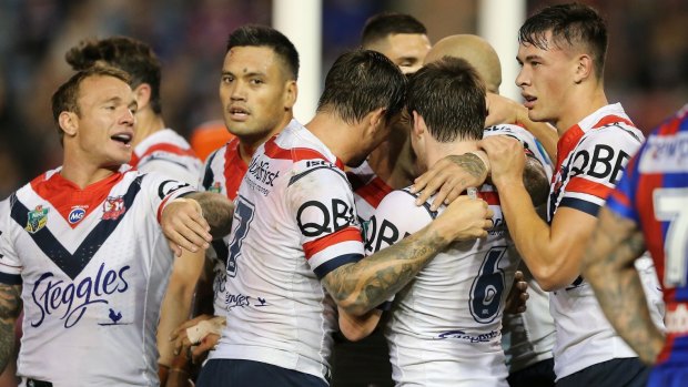 Team effort: The Roosters celebrate another try at McDonald Jones Stadium.