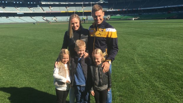 Sam Mitchell with his family at Domain Stadium after announcing his retirement from AFL.