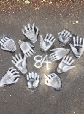 Loren Ries drew this on a road in Huonville, Tasmania, for the Veteran Chalk Challenge to draw attention to 84 Australian veterans' suicides in 2017. 