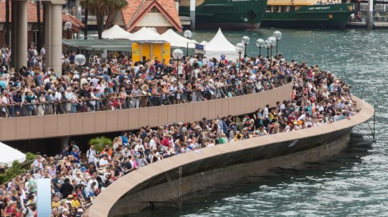 Crowds of people gather on the foreshore of Sydney Cove on Australia Day.