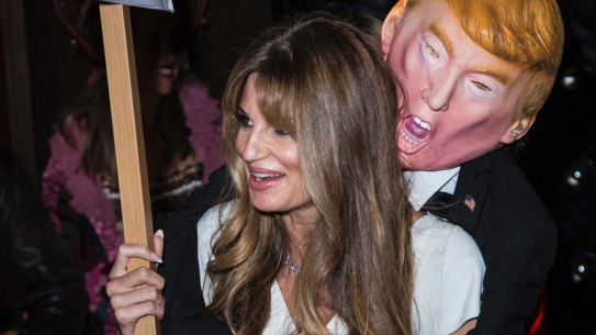 British journalist and heiress Jemima Khan poses for photographers with an effigy of Donald Trump at the Unicef Halloween Ball, in London on Thursday.