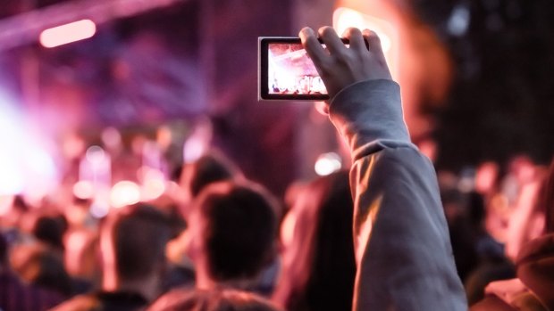 Recording video your with smartphone can stop others enjoying the event.
