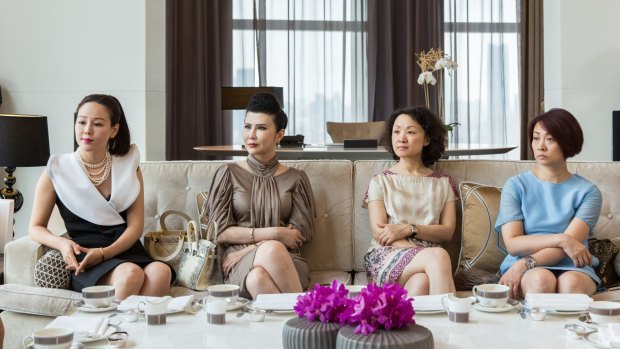 Wealthy Shanghainese matrons learn the fine points of afternoon tea, Western style.