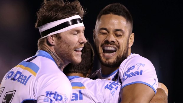 Back to his best: Jarryd Hayne celebrates with teammates during the Titans' win over the Sharks.