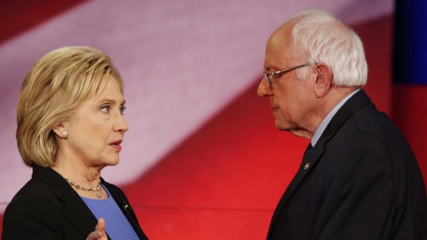 Democratic presidential candidates Hillary Clinton and Senator Bernie Sanders speak during a break in Charleston, SC.