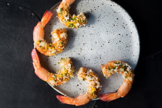 Iki Jime's riff on prawn cocktail, featuring grilled king prawns, dehydrated horseradish, cured duck egg yolk and lemon oil.