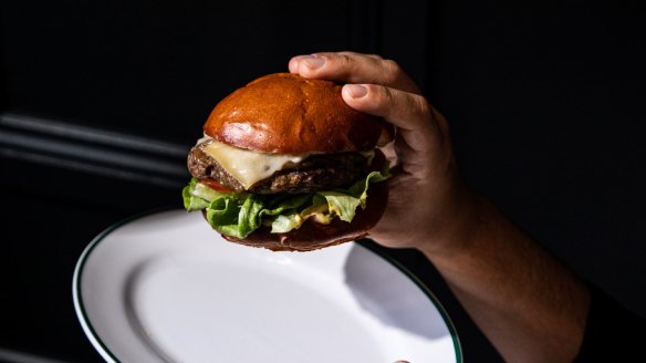 Le Burger with grass-fed brisket and chuck patty, gruyere, tomato and mustard.