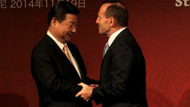 Smells like team spirit: Chinese President Xi Jinping and Prime Minister Tony Abbott at the Australia-China State/Provincial Leaders Forum in Sydney.